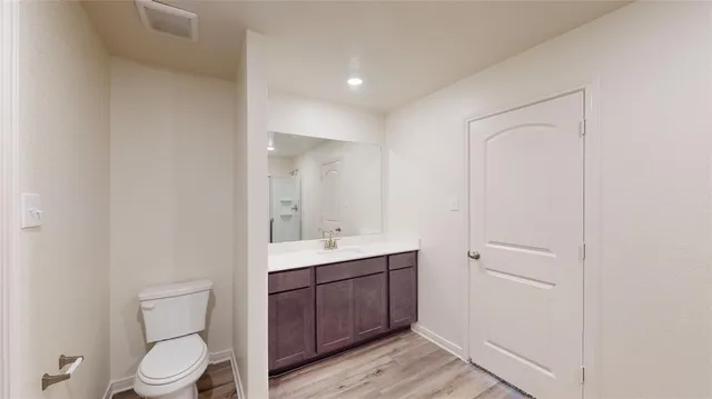 an empty room with a white walls and ceiling fan