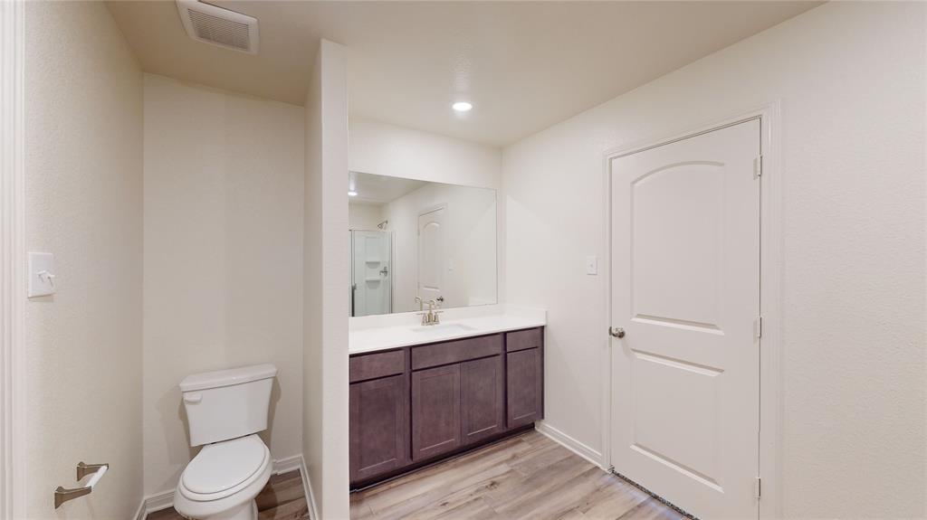 8012 White Sulphur Road Ponder, TX 76259 - Photo 32 of 39 Full bathroom with vanity, light wood-style floors, a shower with door, and recessed lighting