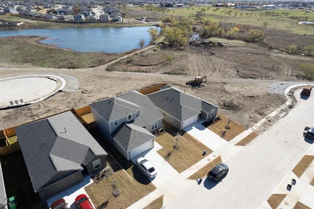 an aerial view of a house with a ocean view