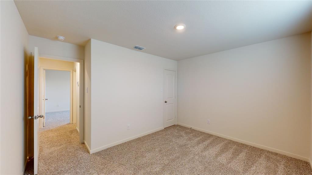 8012 White Sulphur Road Ponder, TX 76259 - Photo 8 of 39 Bedroom 1 - Carpeted spare room with baseboards