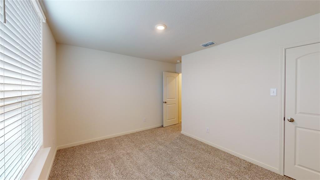 8012 White Sulphur Road Ponder, TX 76259 - Photo 9 of 39 Bedroom 1 -Unfurnished bedroom featuring carpet and baseboards