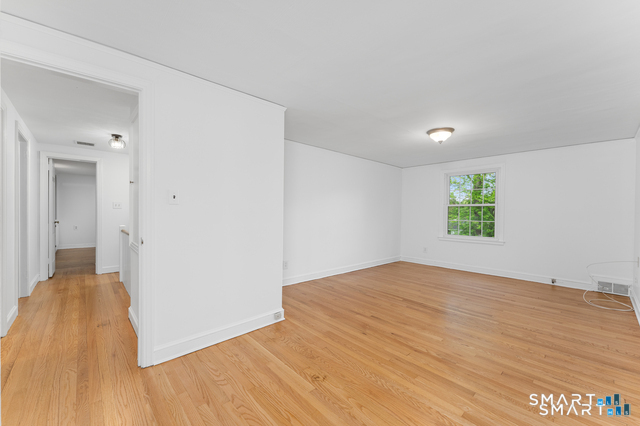 62 Chatham Road Berlin, CT 06037 - Photo 36 of 38 a view of a room with wooden floor and windows