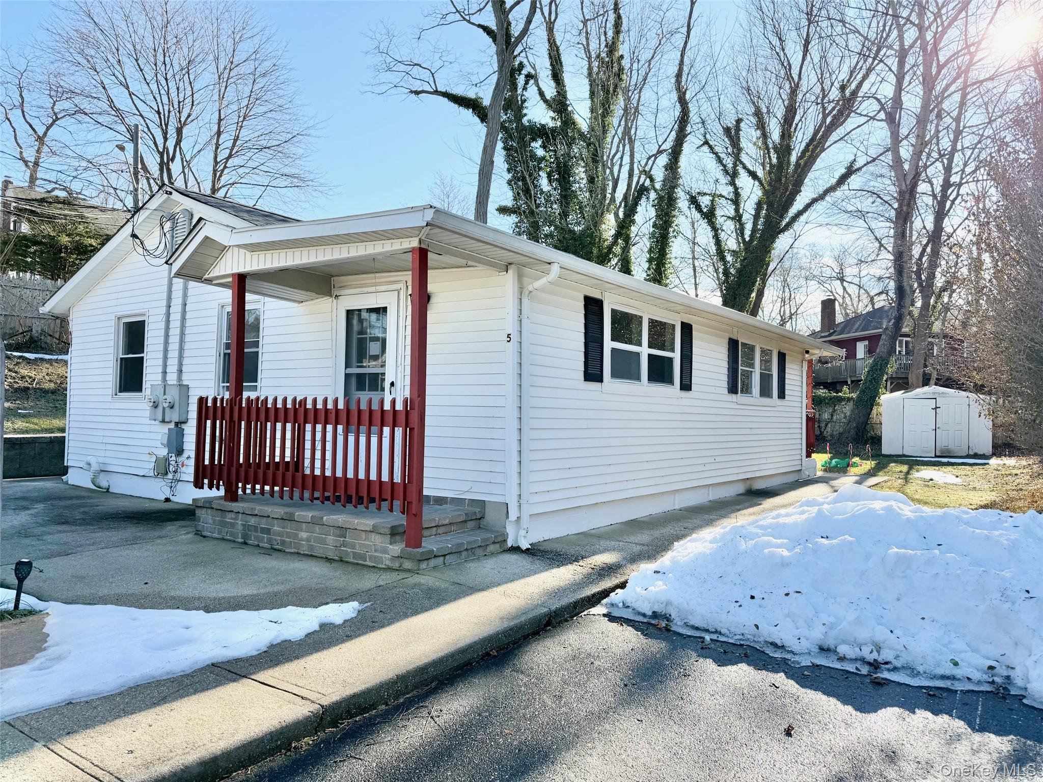 188 Hallock Landing Road Rocky Point, NY 11778 - Photo 1 of 25 View of front of property with a storage shed and covered porch