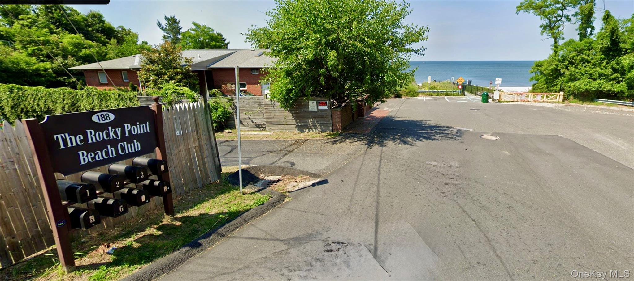 188 Hallock Landing Road Rocky Point, NY 11778 - Photo 22 of 25 View of asphalt road with a water view and curbs
