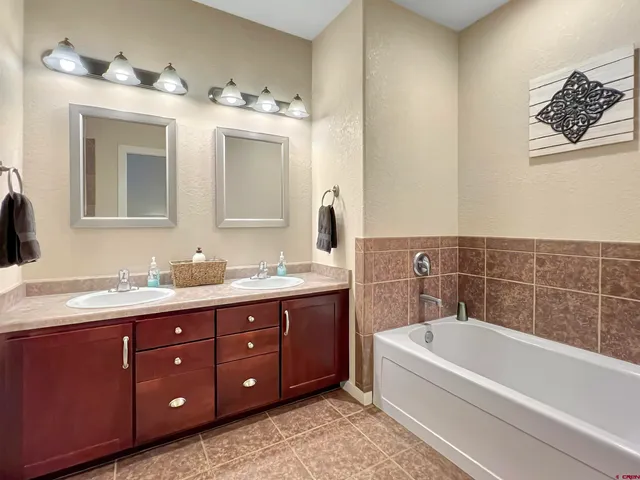 a bathroom with a shower and a sink