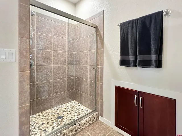 a bathroom with a bathtub and a shower