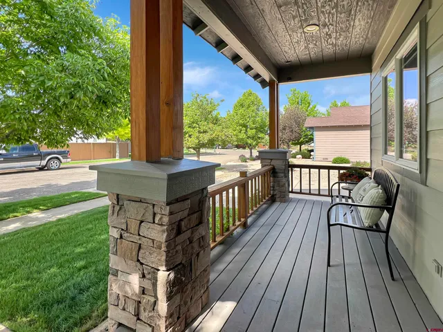 a view of a two chairs in the balcony