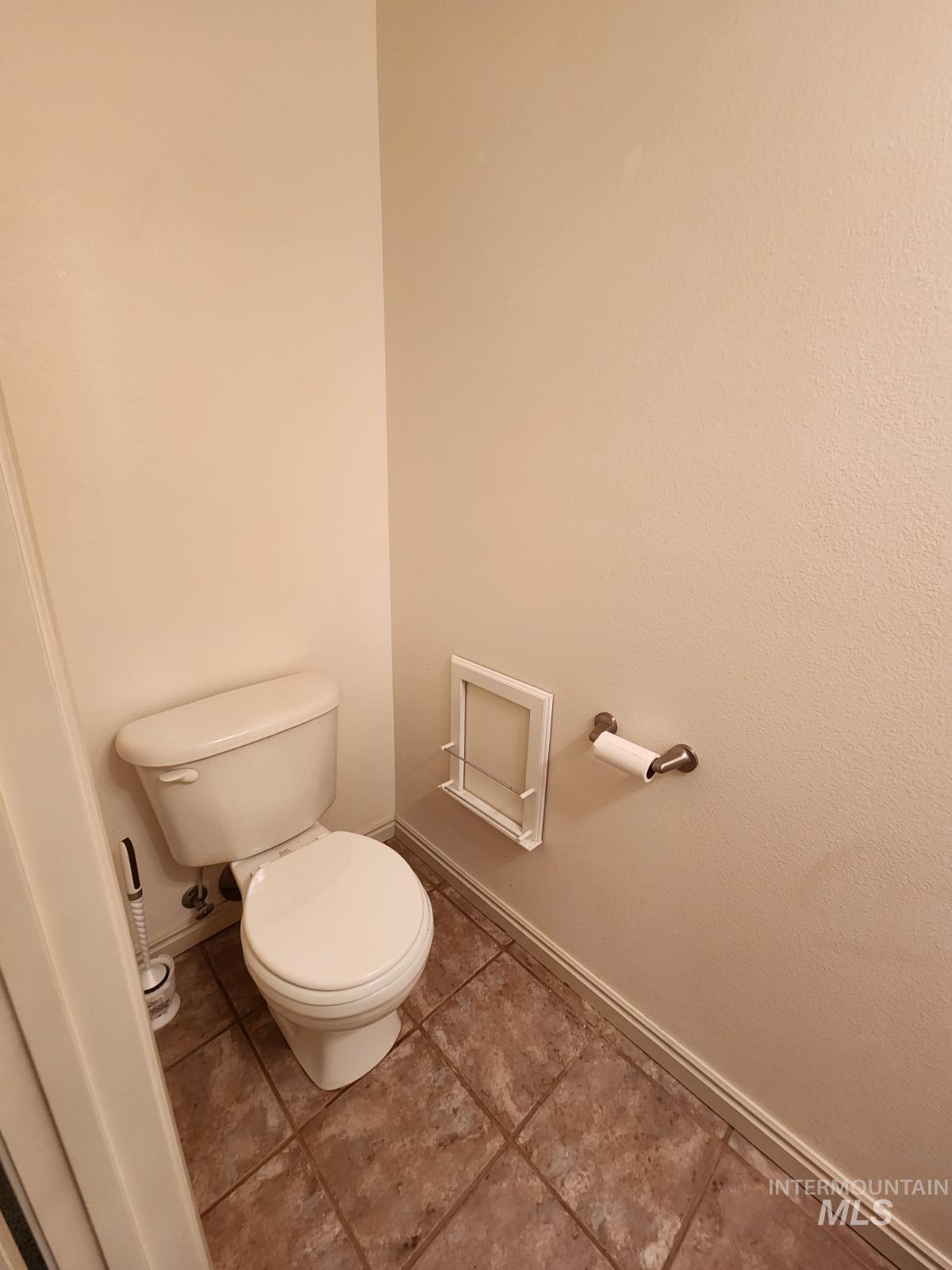 1000 North Rodeo Street Parma, ID 83660 - Photo 22 of 33 Bathroom featuring baseboards and light tile patterned flooring