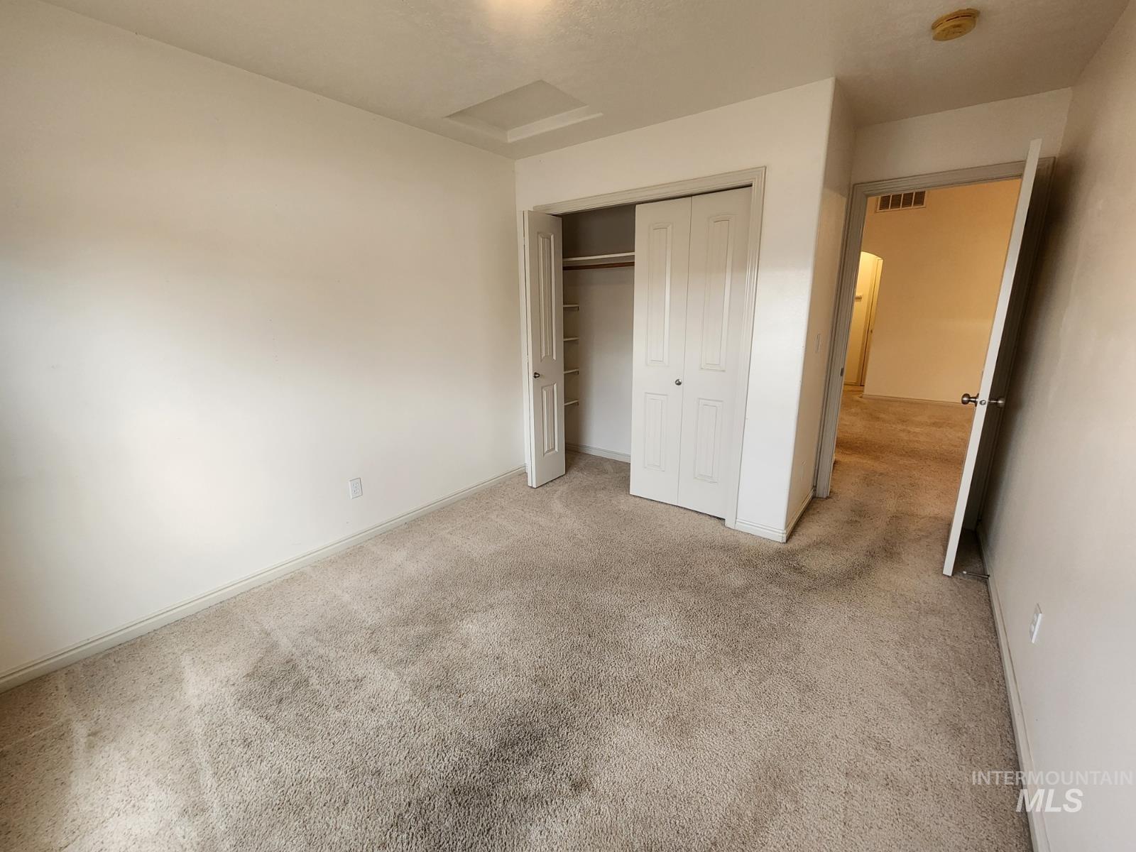1000 North Rodeo Street Parma, ID 83660 - Photo 23 of 33 Unfurnished bedroom featuring light carpet and a closet
