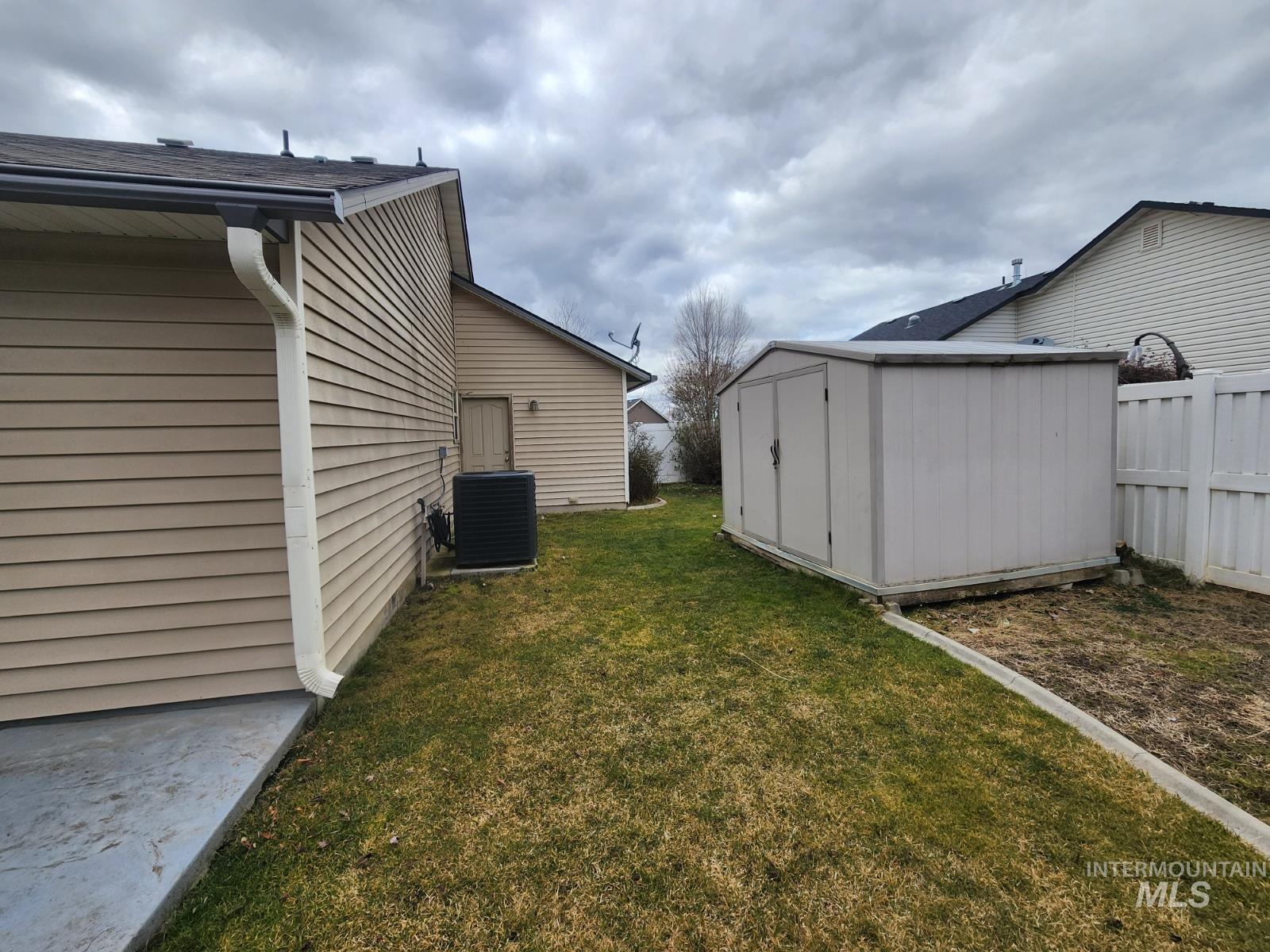 1000 North Rodeo Street Parma, ID 83660 - Photo 31 of 33 Fenced yard with a storage unit