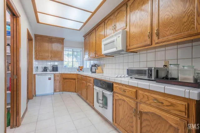 a kitchen with cabinets and window