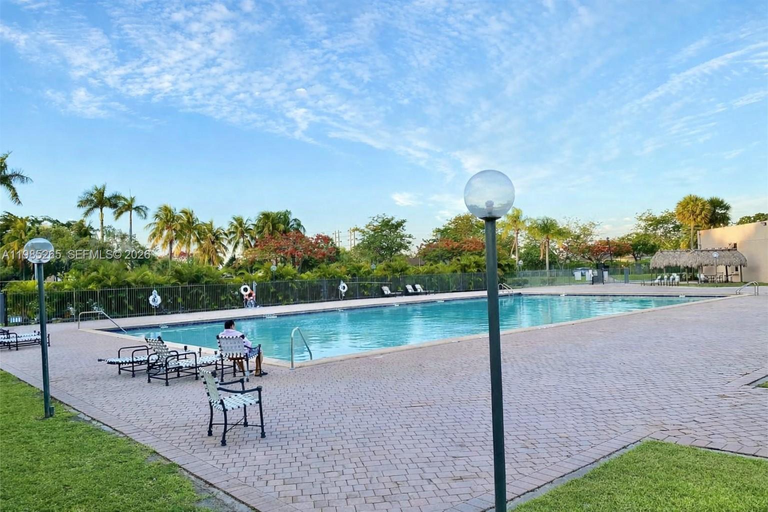 8520 Southwest 133rd Avenue Road, Unit 112 Miami, FL 33183 - Photo 11 of 11 a view of a backyard with a patio