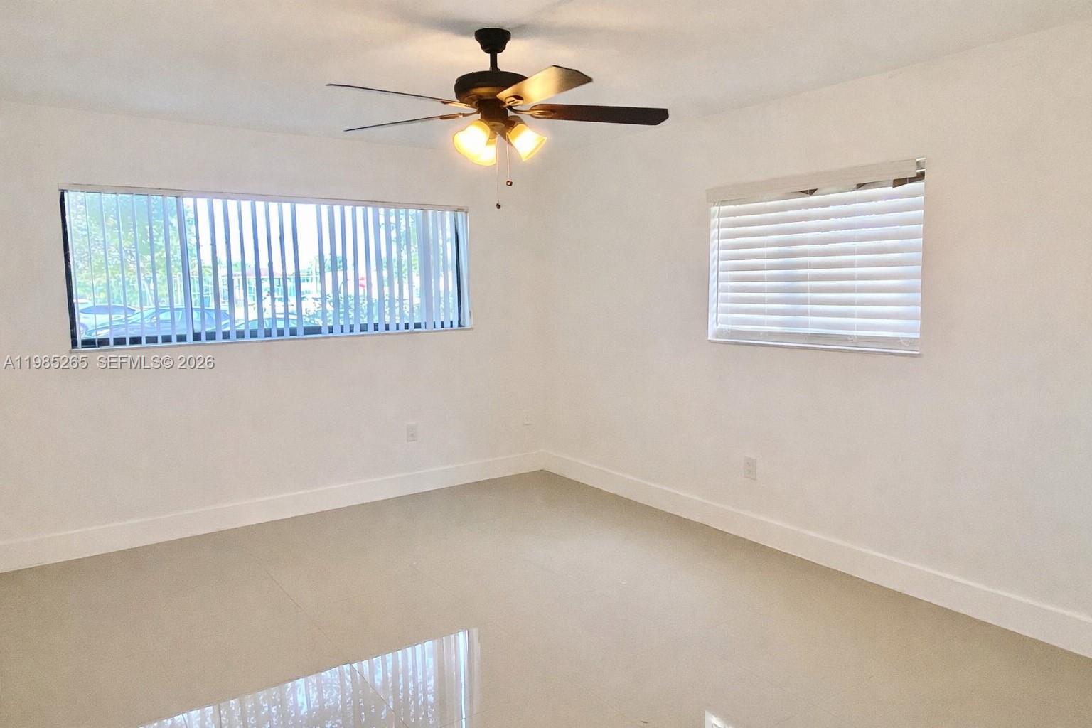 8520 Southwest 133rd Avenue Road, Unit 112 Miami, FL 33183 - Photo 7 of 11 an empty room with a window