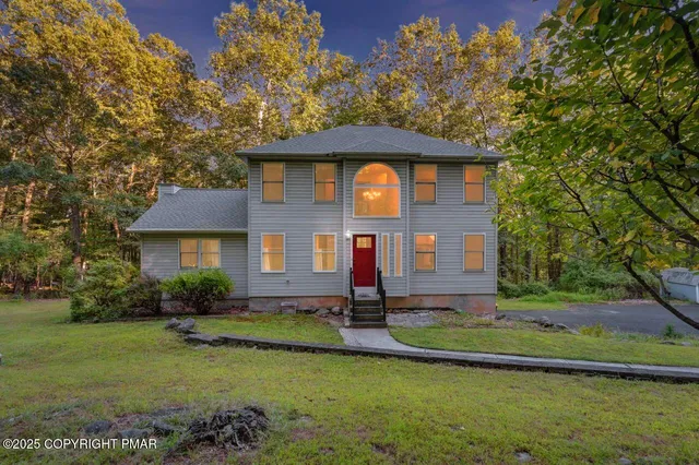 a front view of a house with a yard