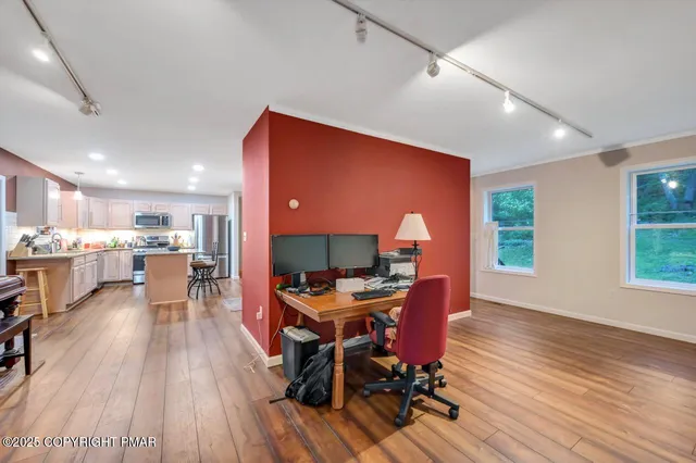 a kitchen with stainless steel appliances kitchen island granite countertop a stove and refrigerator
