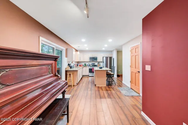 a kitchen with refrigerator and cabinets