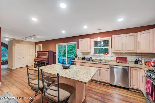 a workspace with furniture window and wooden floor