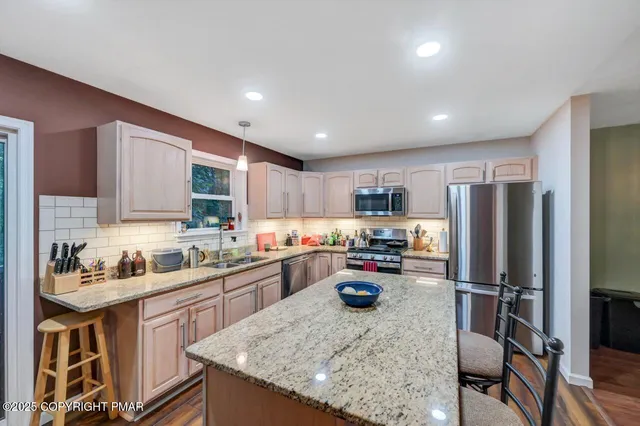 a bedroom with a bed lamp and window