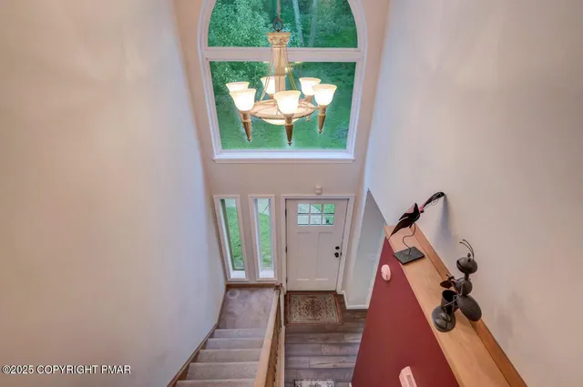 a view of staircase and living room with furniture