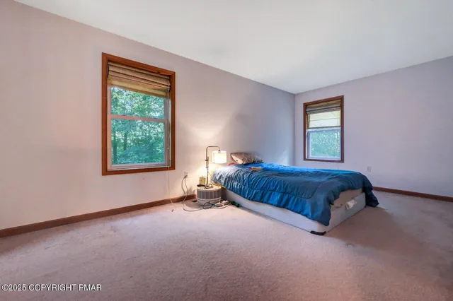 a view of a livingroom with furniture and a ceiling fan