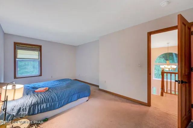 a living room filled with furniture and a window