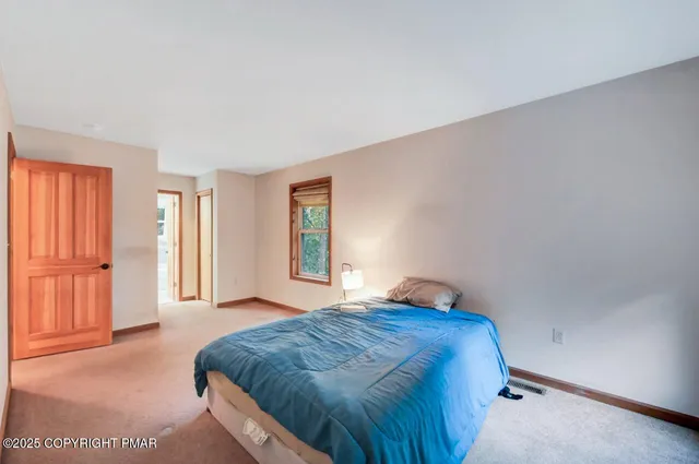 a living room with a couch and a window