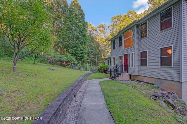 a view of a balcony with wooden floor