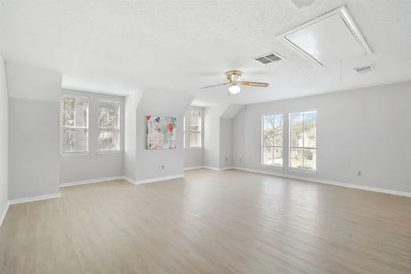 a view of staircase with wooden floor and a window