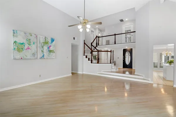 a view of an entryway with wooden floor