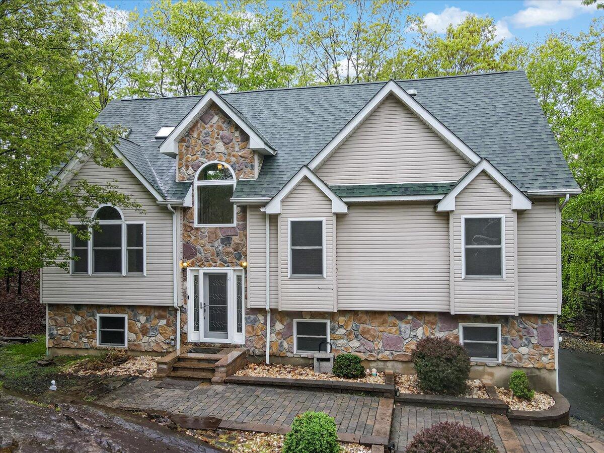 2330 Burntwood Drive East Stroudsburg, PA 18301 - Photo 1 of 44 a view of a yard in front of a house