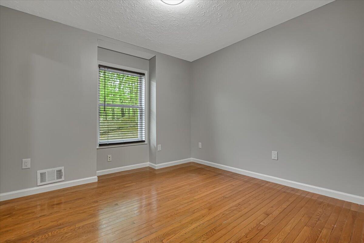 2330 Burntwood Drive East Stroudsburg, PA 18301 - Photo 14 of 44 wooden floor in an empty room with a window