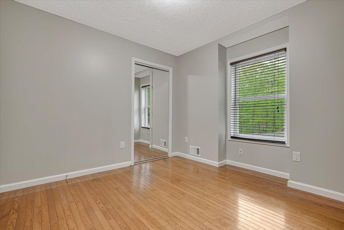 2330 Burntwood Drive East Stroudsburg, PA 18301 - Photo 15 of 44 a view of an empty room with wooden floor and a window