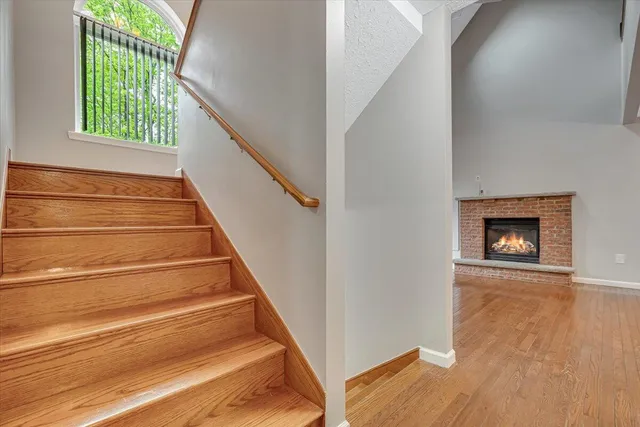 a view of an entryway with wooden floor