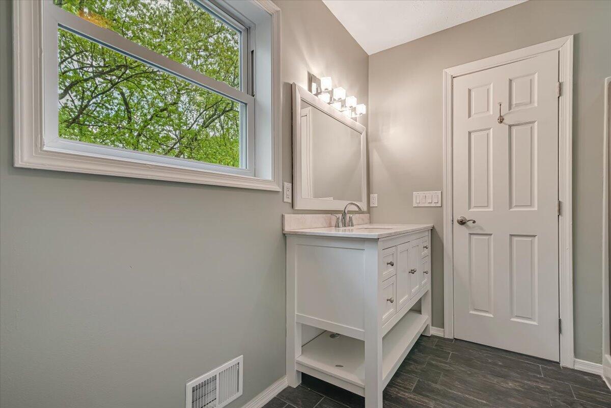 2330 Burntwood Drive East Stroudsburg, PA 18301 - Photo 30 of 44 a bathroom with a sink and a mirror
