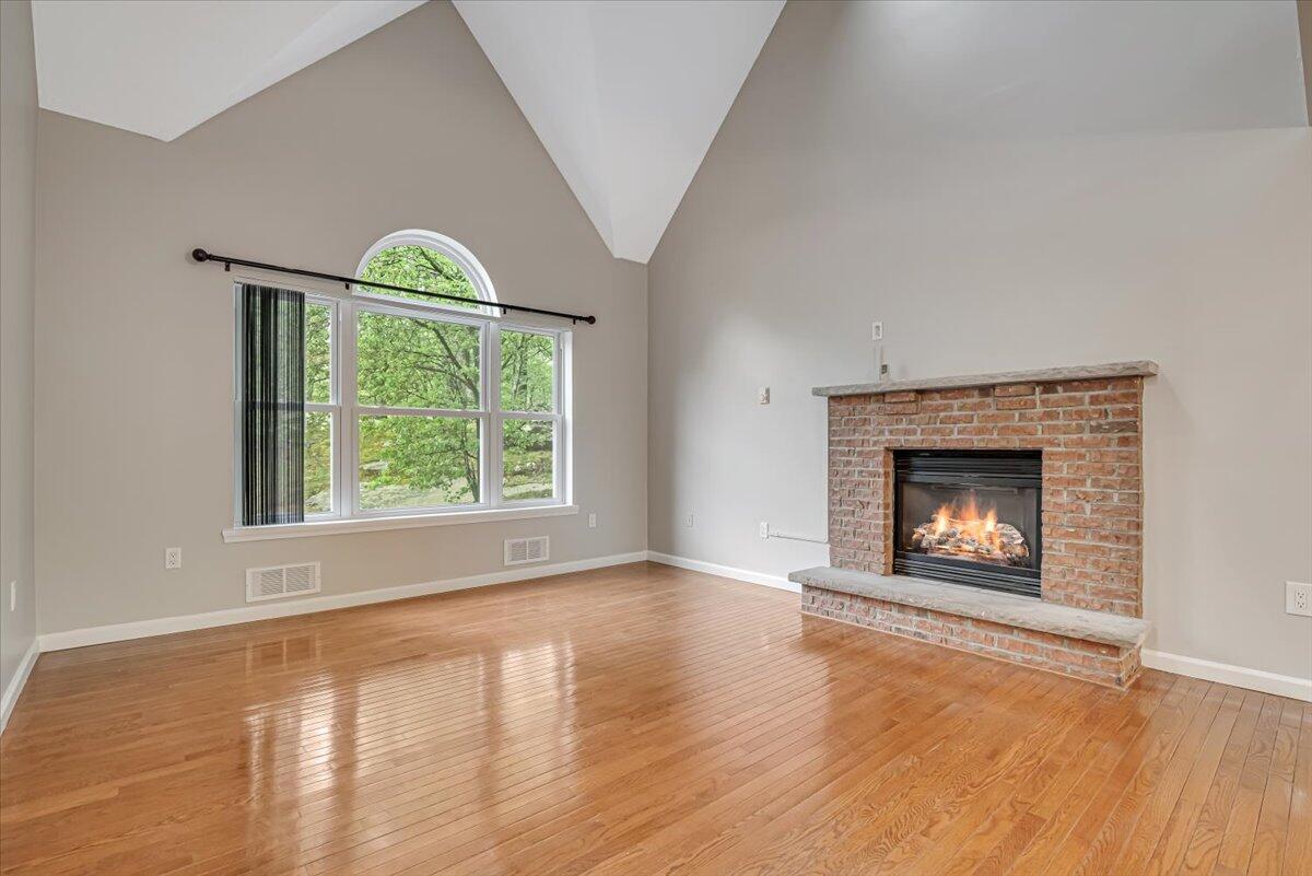 2330 Burntwood Drive East Stroudsburg, PA 18301 - Photo 3 of 44 a view of an empty room with a window and fireplace