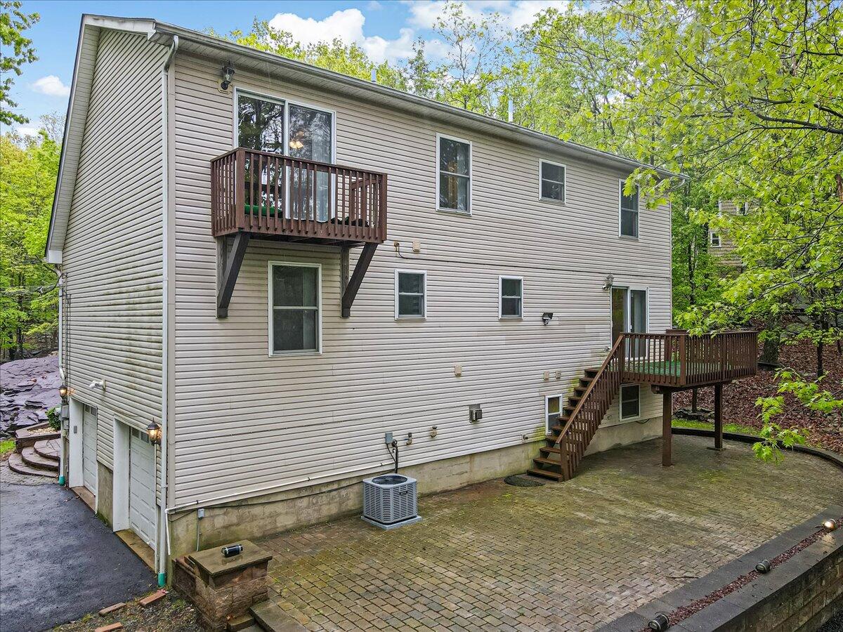 2330 Burntwood Drive East Stroudsburg, PA 18301 - Photo 38 of 44 a view of a house with wooden deck and furniture