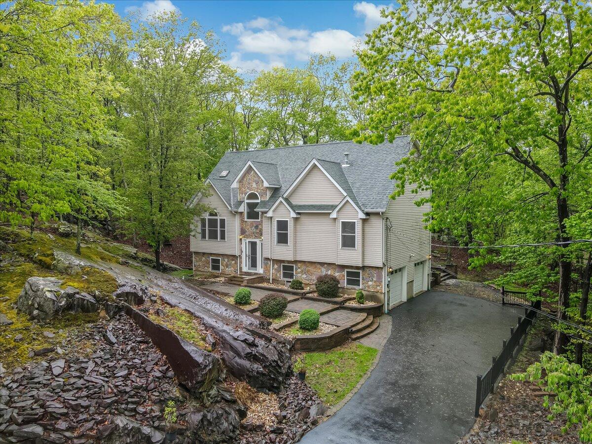 2330 Burntwood Drive East Stroudsburg, PA 18301 - Photo 41 of 44 a view of a house with a big yard plants and large trees