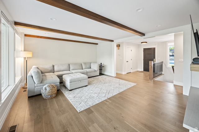 1774 Country Club Drive Logan, UT 84321 - Photo 3 of 28 Spacious living area featuring light wood-finish flooring, exposed ceiling beams, recessed lighting, and large windows