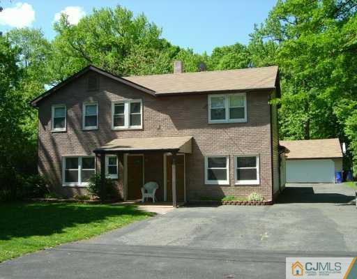 630 Myrtle Road North Brunswick, NJ 08902 - Photo 1 of 8 a front view of a house with a garden and plants