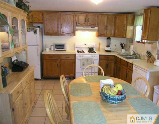 630 Myrtle Road North Brunswick, NJ 08902 - Photo 2 of 8 a kitchen with a sink and cabinets