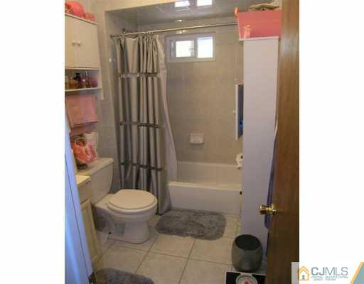 630 Myrtle Road North Brunswick, NJ 08902 - Photo 7 of 8 a bathroom with a toilet and a shower