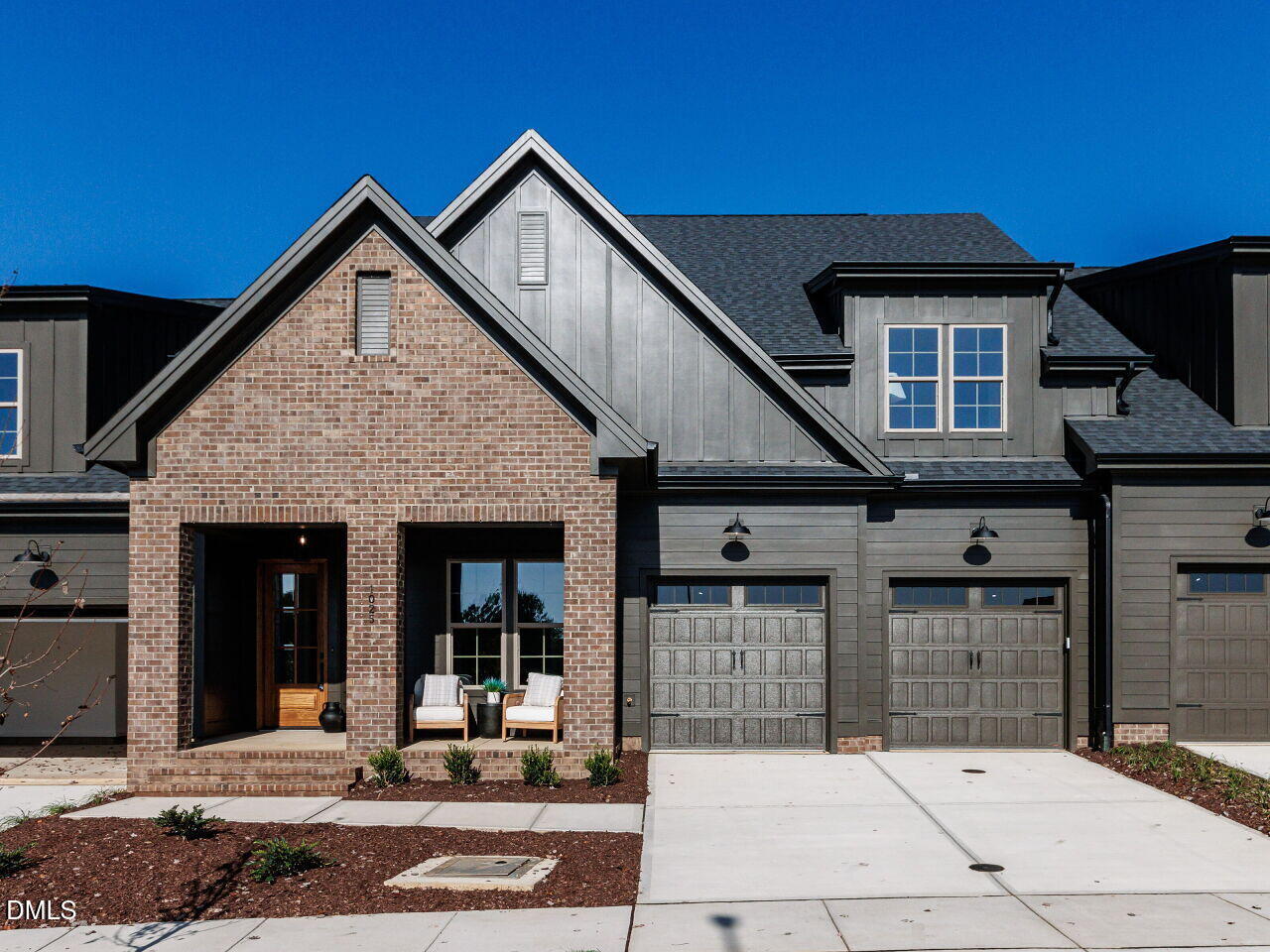 a front view of a house with garage
