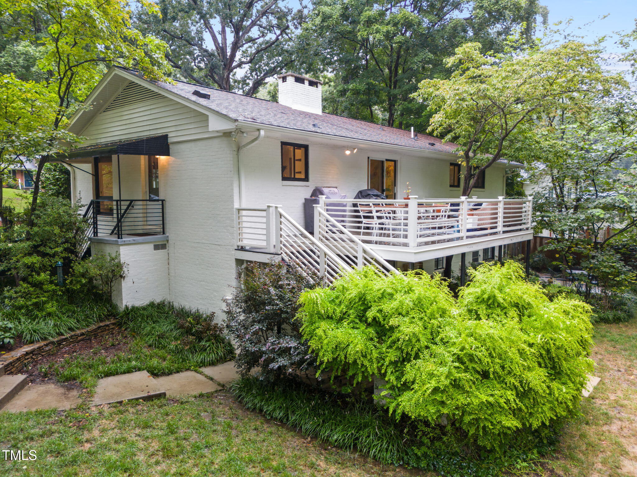 806 Beaver Dam Road Raleigh, NC 27607 - Photo 3 of 37 a front view of a house with a yard