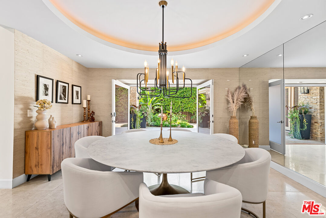 10424 Valley Spring Lane Toluca Lake, CA 91602 - Photo 11 of 44 a dining room with furniture and window