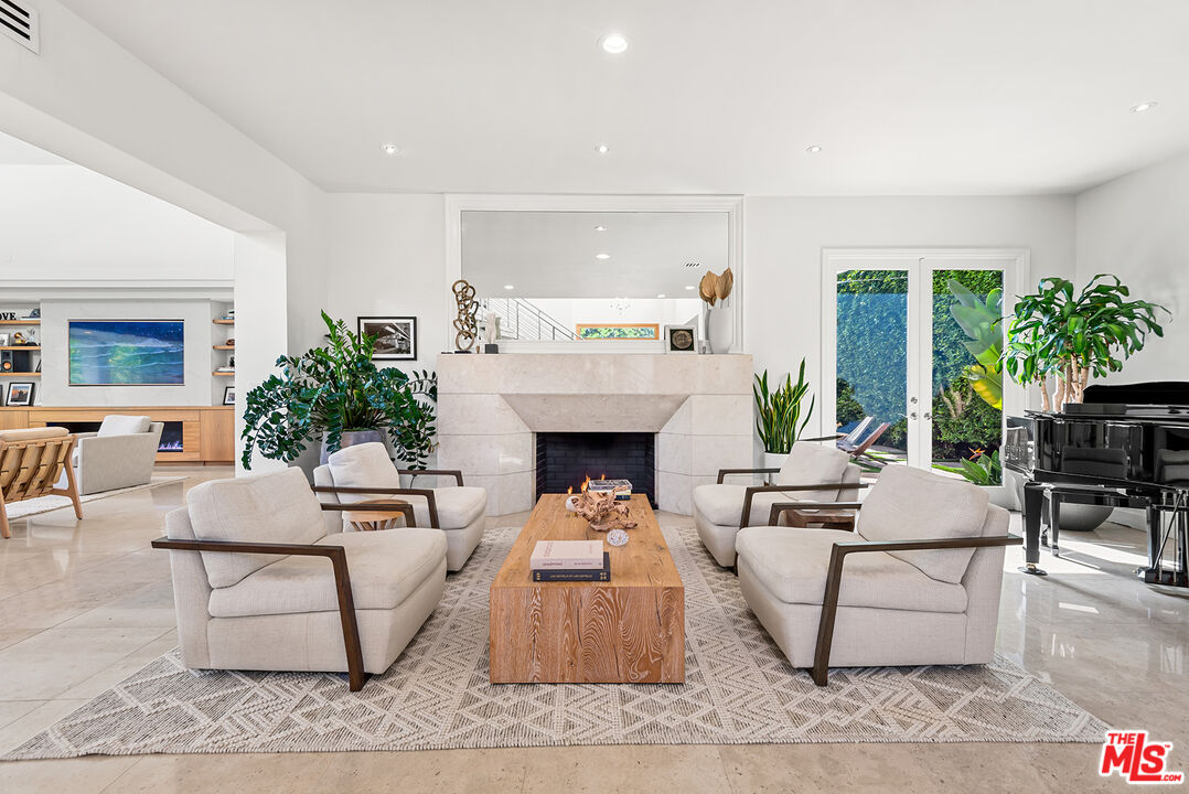 10424 Valley Spring Lane Toluca Lake, CA 91602 - Photo 14 of 44 a living room with furniture and a fireplace