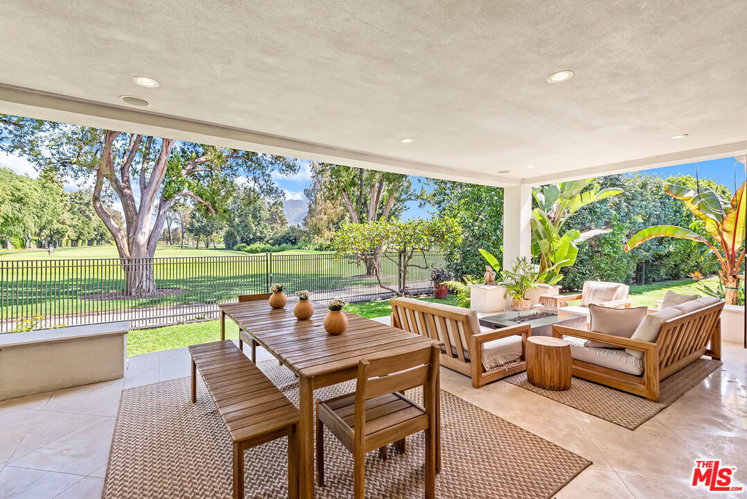 10424 Valley Spring Lane Toluca Lake, CA 91602 - Photo 16 of 44 a living room with furniture and a large window