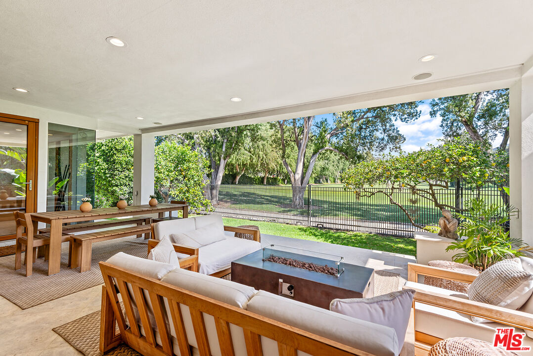 10424 Valley Spring Lane Toluca Lake, CA 91602 - Photo 17 of 44 a room with furniture and a large window