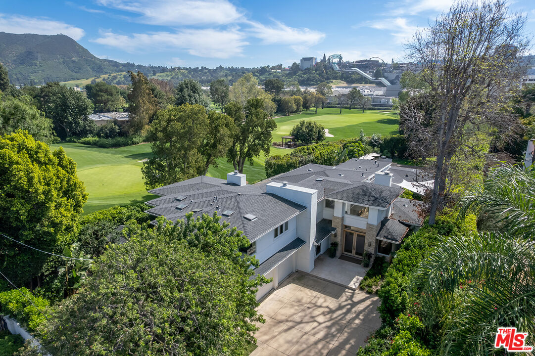 10424 Valley Spring Lane Toluca Lake, CA 91602 - Photo 2 of 44 an aerial view of a house with garden space and outdoor seating