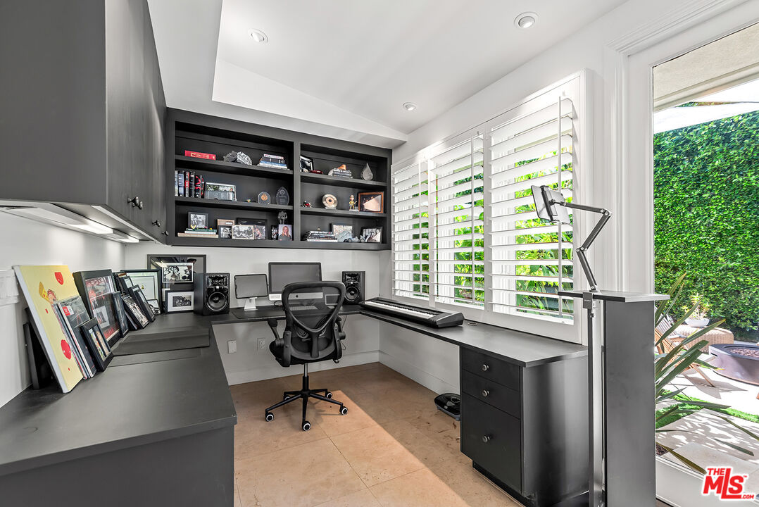 10424 Valley Spring Lane Toluca Lake, CA 91602 - Photo 21 of 44 a view of a livingroom with workspace and a window