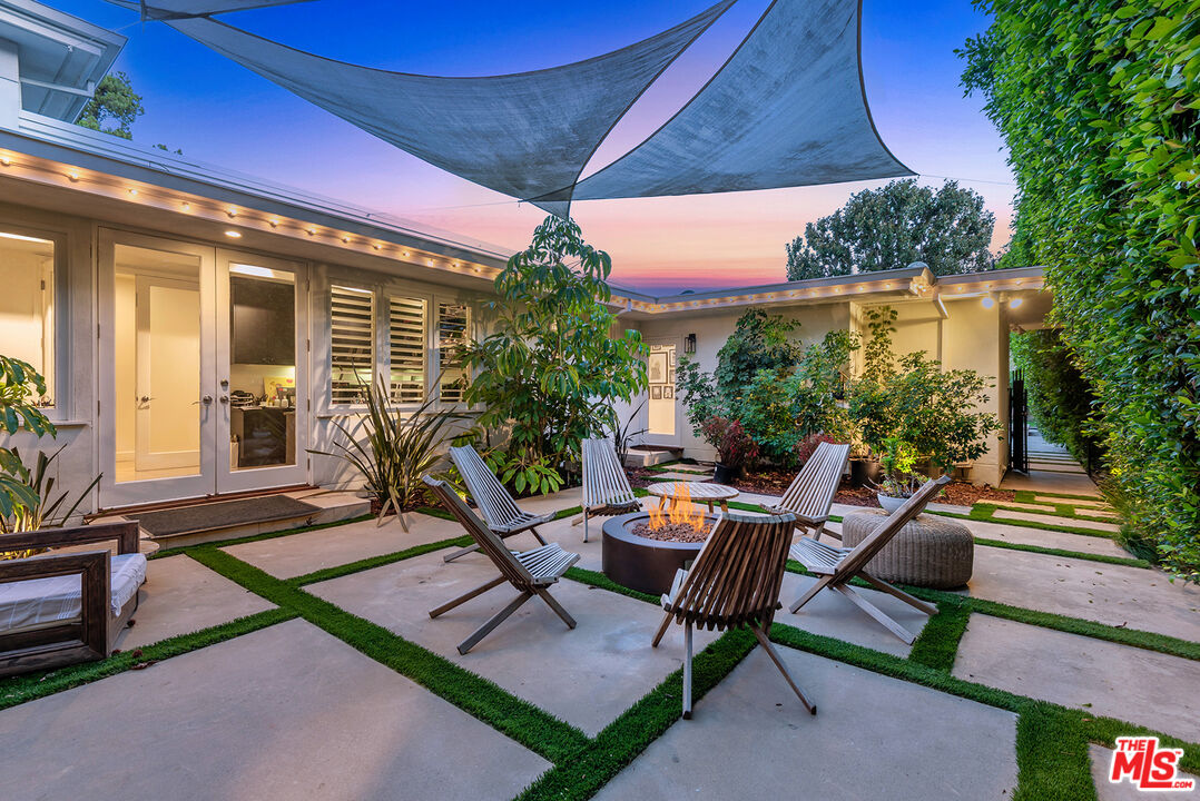 10424 Valley Spring Lane Toluca Lake, CA 91602 - Photo 22 of 44 a view of an outdoor sitting area with couch and table